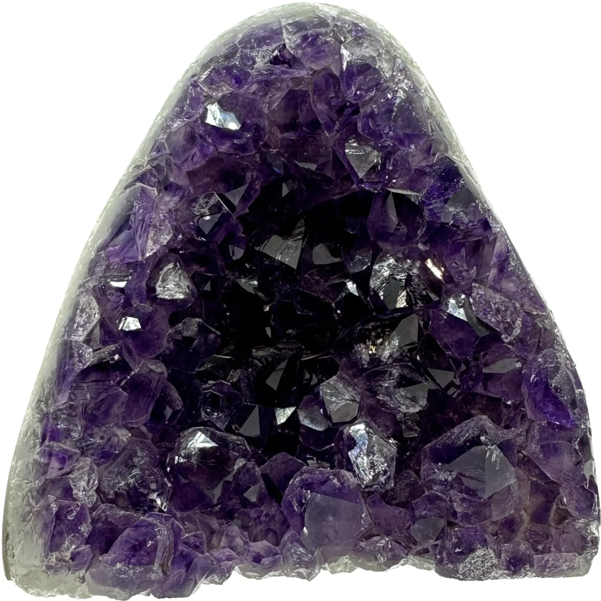 This is an amethyst Stand up from Uruguay. It is triangular in shape and possesses deep purple crystals.