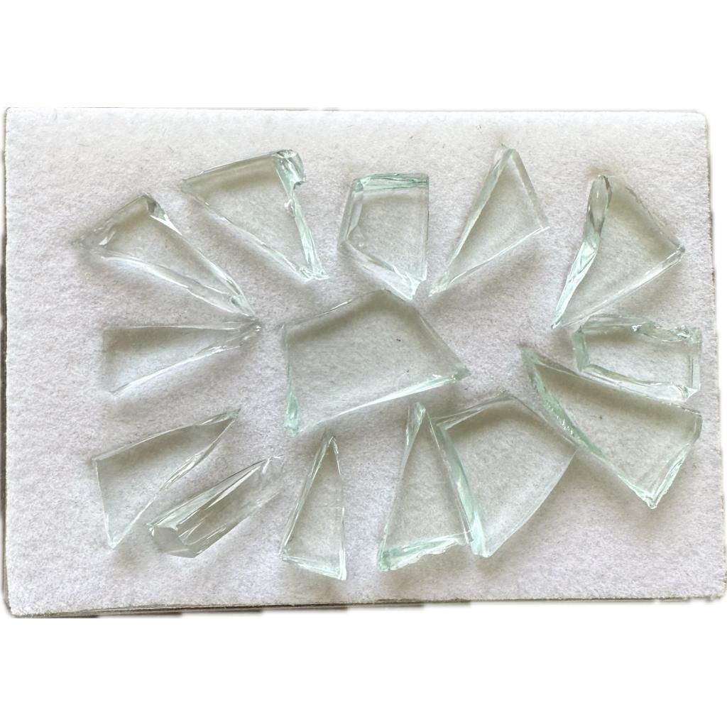 This is a picture of a group of what looks like clear glass shards. These were caused by the Chelyabinsk impact in 2013.