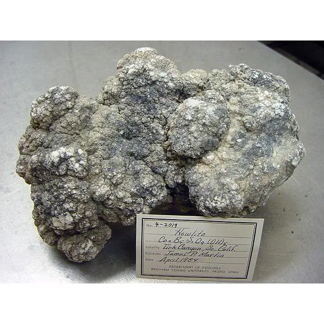 Howlite polished stand up, stark white color with grey veining